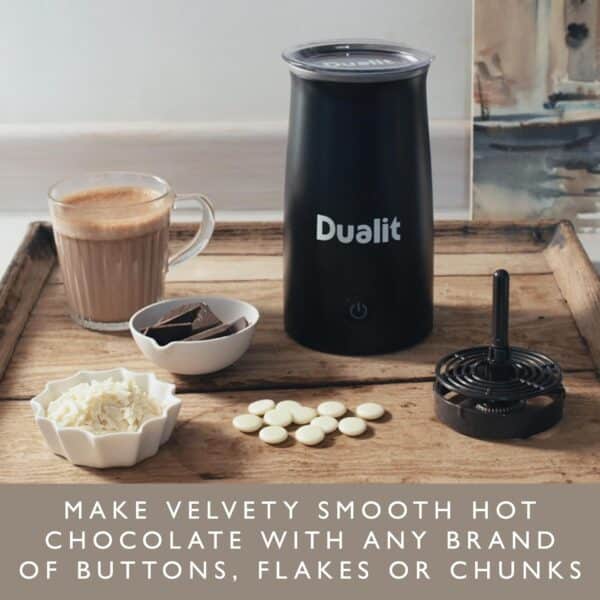 Dualit handheld milk frother and hot chocolate maker on a kitchen counter with ingredients for hot chocolate.