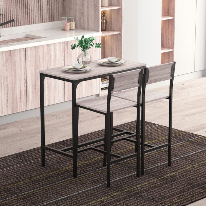 HOMCOM table and bar stool set with metal frame and MDF top, in black, displayed in a modern kitchen.