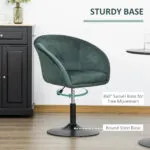 Green Homcom Swivel Bar Stool with Sturdy Round Steel Base Positioned Next to a Black Cabinet